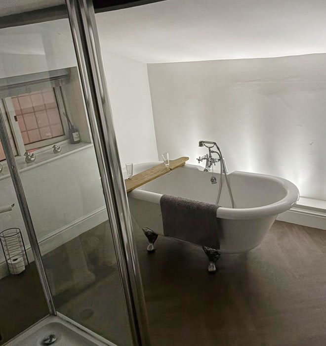 Bathroom with roll top bath